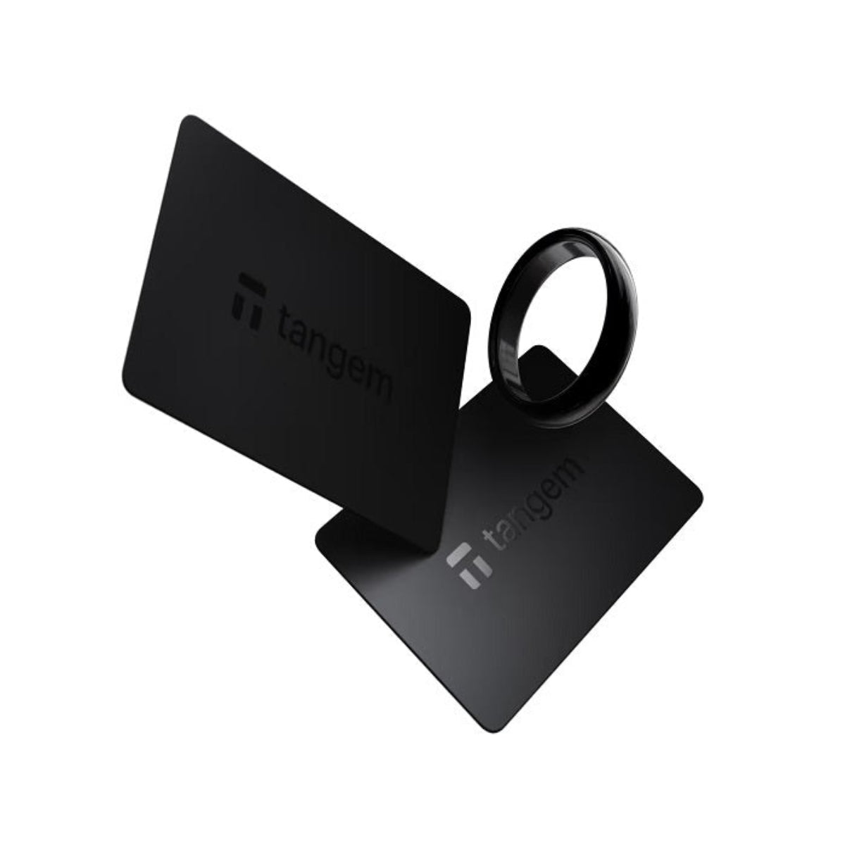 Black Tangem hardware wallet components on a white background