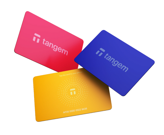 Three Tangem cards in red, blue, and yellow on a white background
